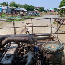 Engine of our boat with narrow Sangker River
