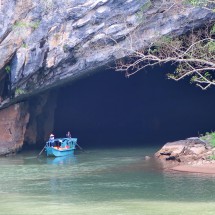 Boat leaving Phong Nha Cave which is the largest known river cave on earth
