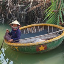 Lady in a tiny round boat