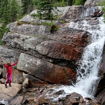 Rosemarie with a waterfall close to Lake Agnes