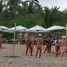 Nudes playing volleyball