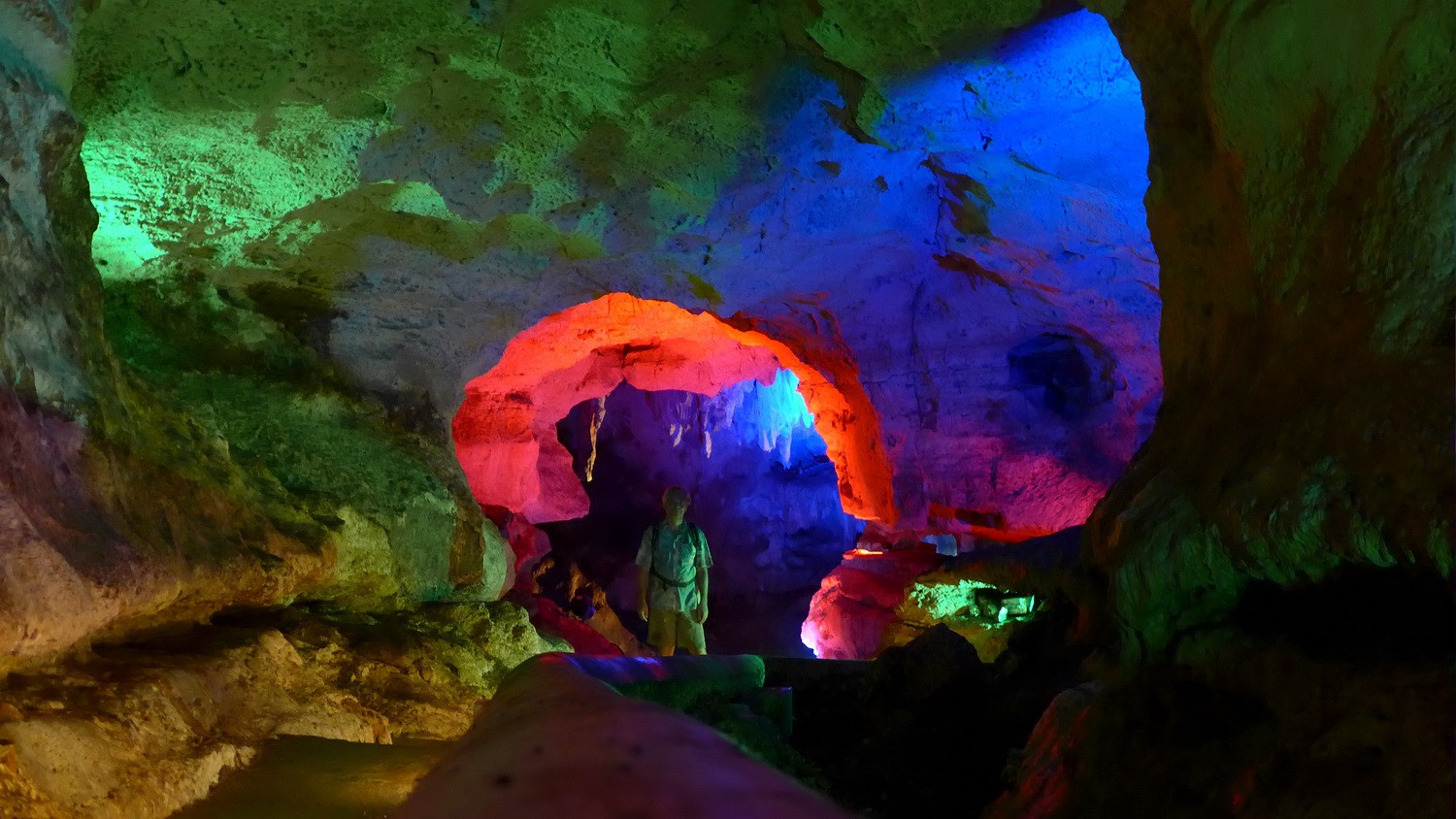 Going into one of the caves Grutas de X'Tacumbilzuna'an with colorful illumination