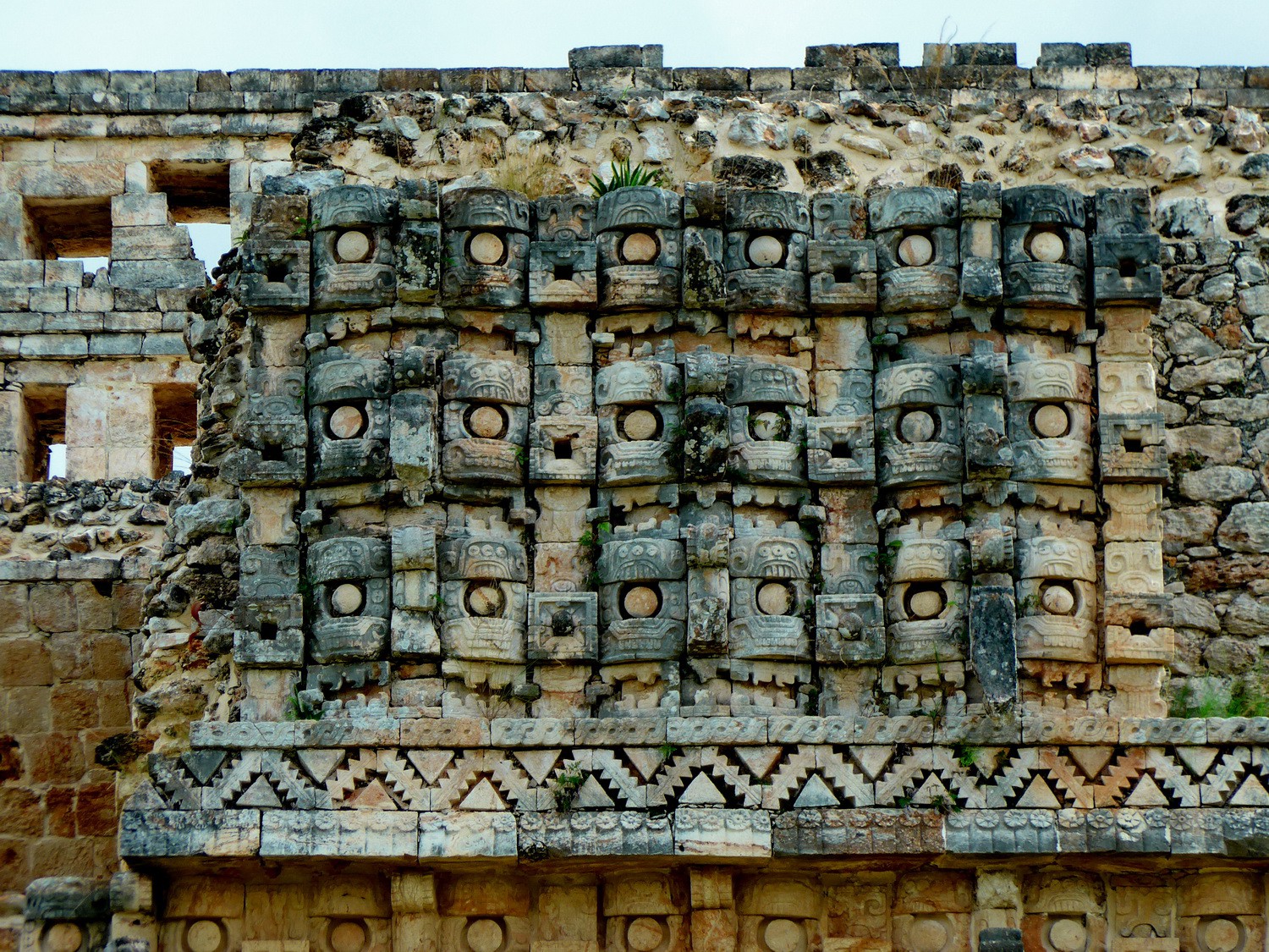 Facade of El palacio de los Mascarones (Place of masks) in Kabáh with the rain god Chac