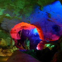 Going into one of the caves Grutas de X'Tacumbilzuna'an with colorful illumination
