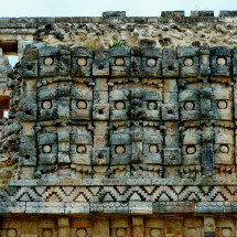 Facade of El palacio de los Mascarones (Place of masks) in Kabáh with the rain god Chac