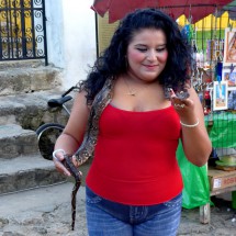 Girl with a snake in front of the monastery