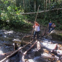 Crossing a stream on Sendero los Quetzales