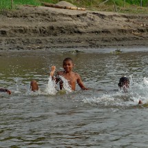 Kids enjoying the warm water of the river