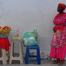 African Lady selling fruit salad in the old town