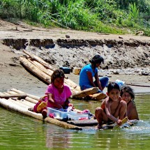 Kids washing clothes in the river Rio Tambo