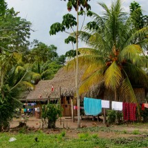 In the village Unini with a typical house of the Shipibo indigenous people