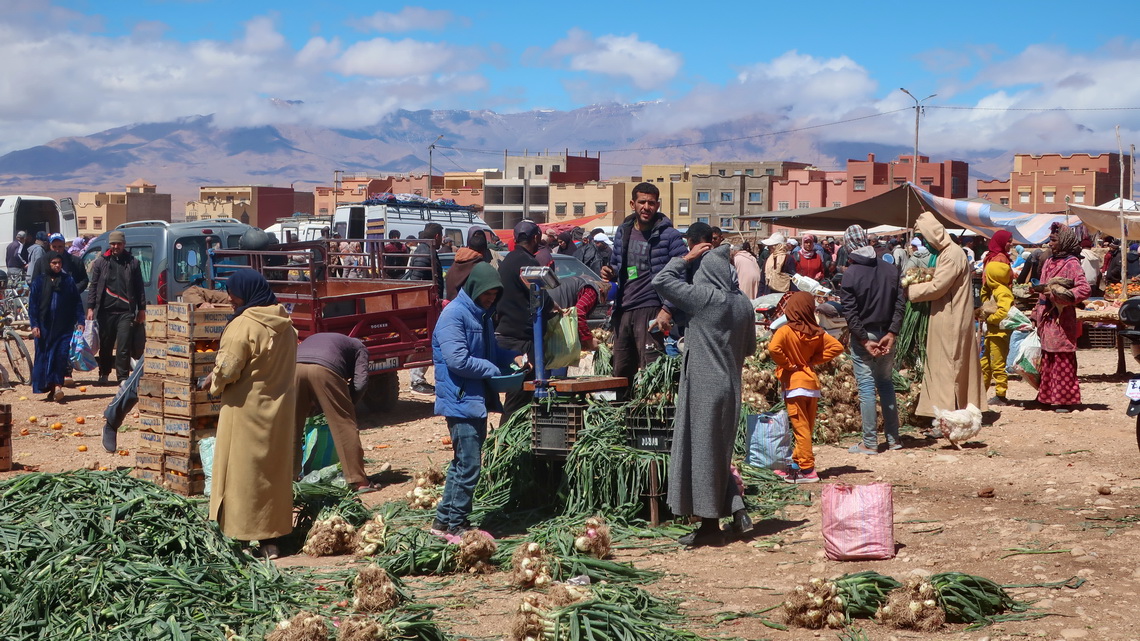 Market in Outat El Haj with the highest mountains of the Middle Atlas in the clouds