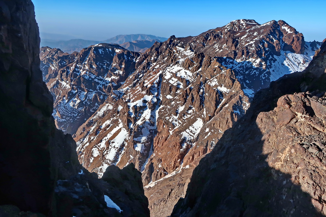 Close to the summit of Toubkal West with Timesguida and Ras Ouanoukrim on the top right