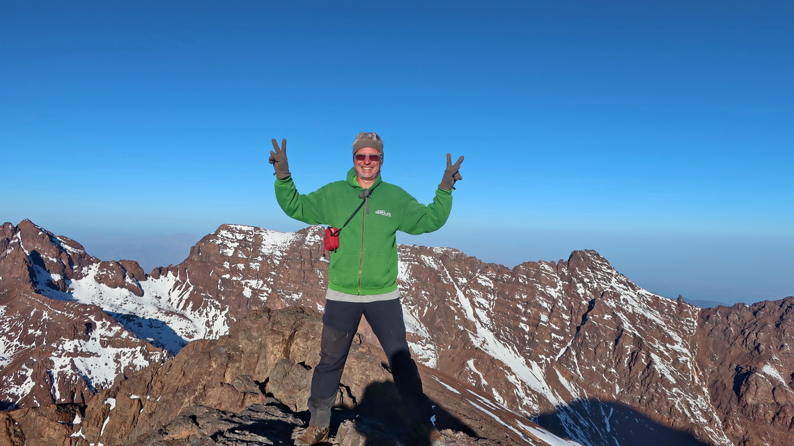 Alfred on the 4018 meter high Toubkal West, wearing only a light jacket, at 8 a.m