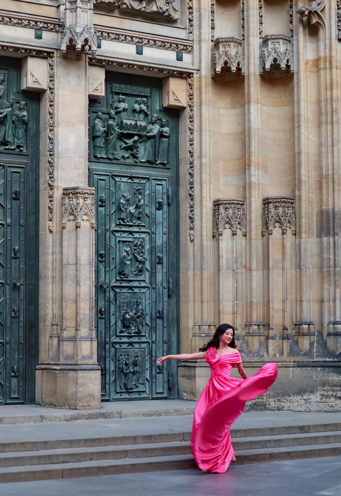 Lady dancing in front of St. Vitus Cathedral