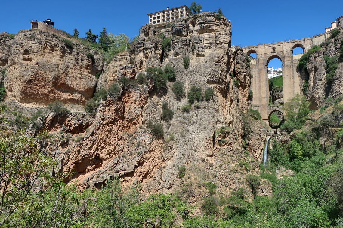 Rocks of Ronda with the waterfall of Rio Guadalevin and its famous bridge Puente Nuevo