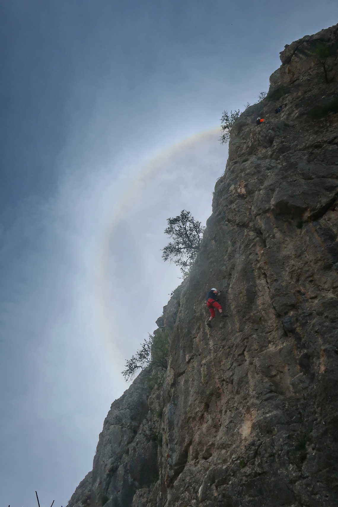 Marion in the optical phenomenon halo on Via Ferrata Sierra de Gracia