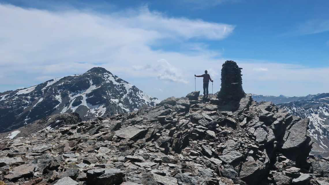 Alfred on the summit of 3369 meters high La Alcazaba with Pico de Mulhacén on the left which is with 3482 meters sea-level the tallest peak of Sierra Nevada