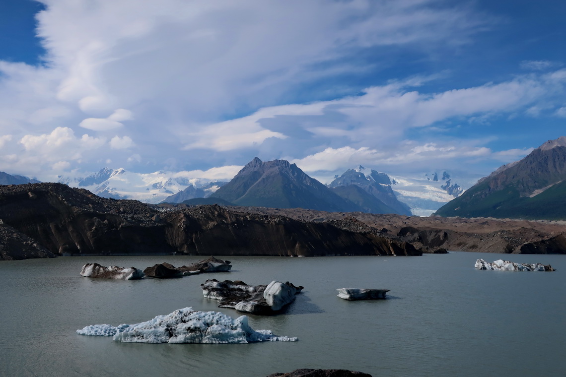 Lake with icebergs on foot of huge Kennicott Glacier