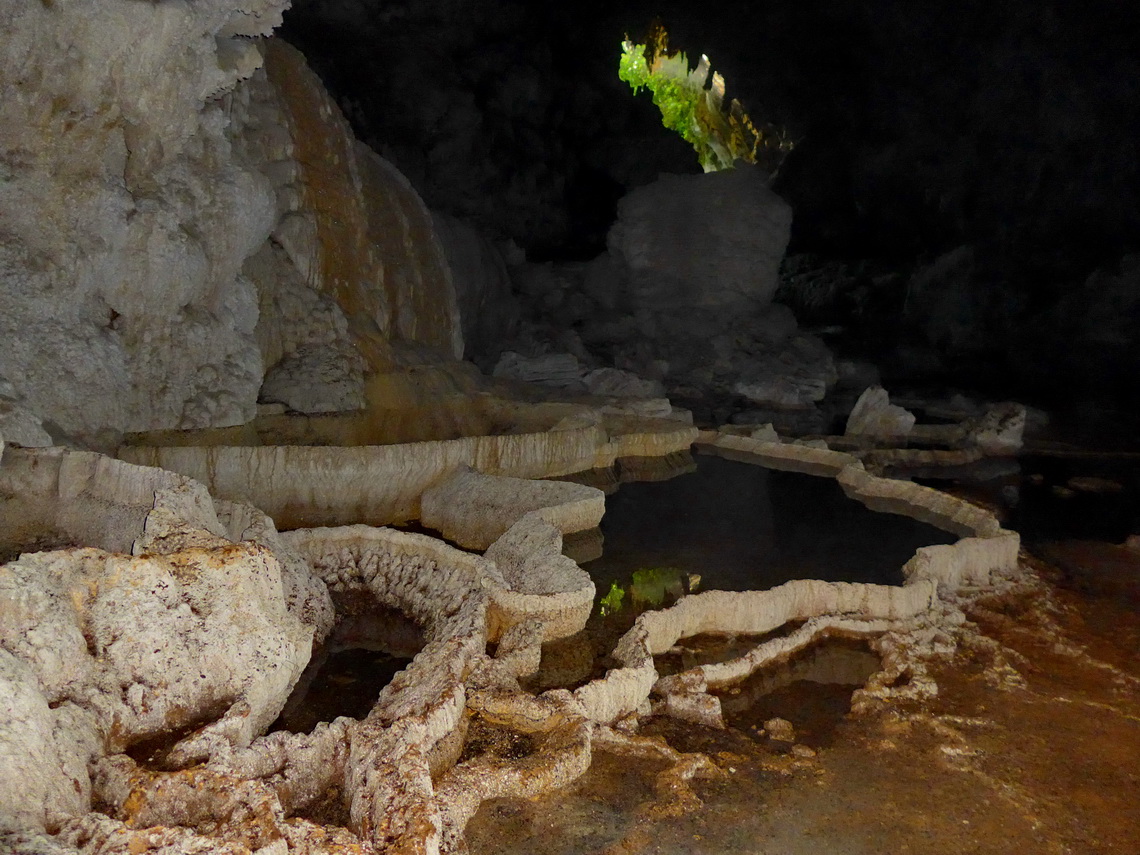 Basins in the cave with its entrance