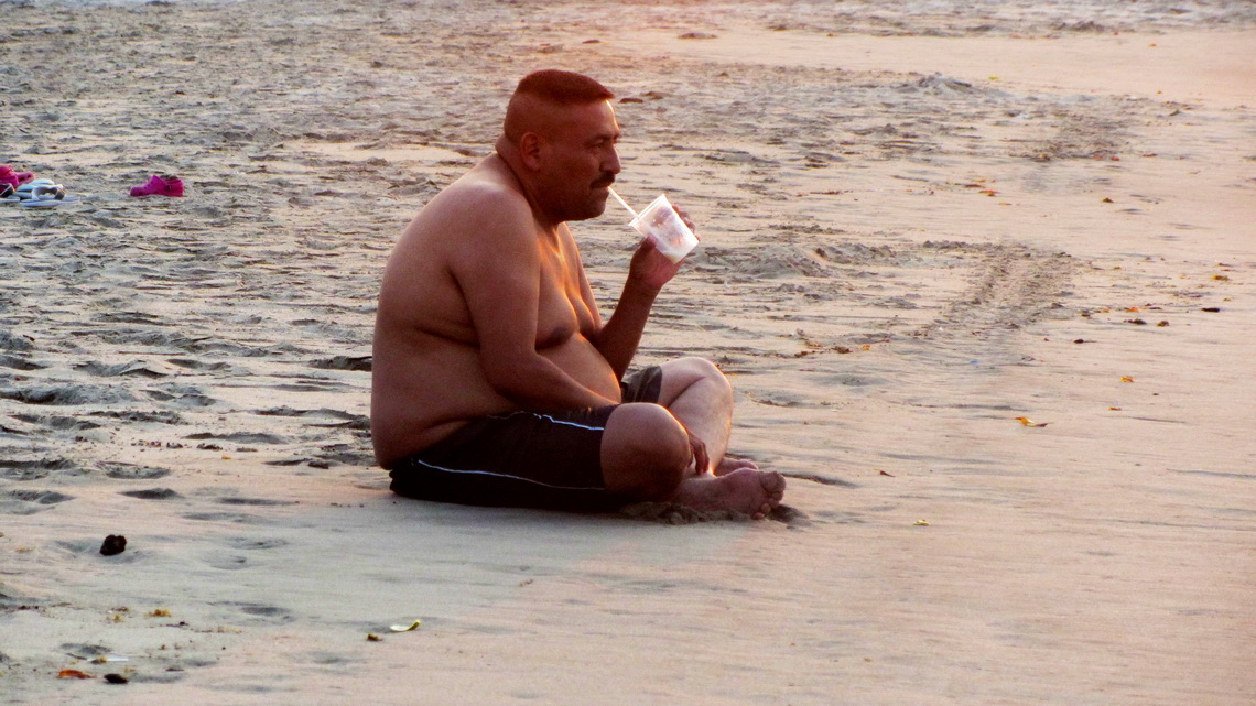 Honduran man enjoying the beach of Tela