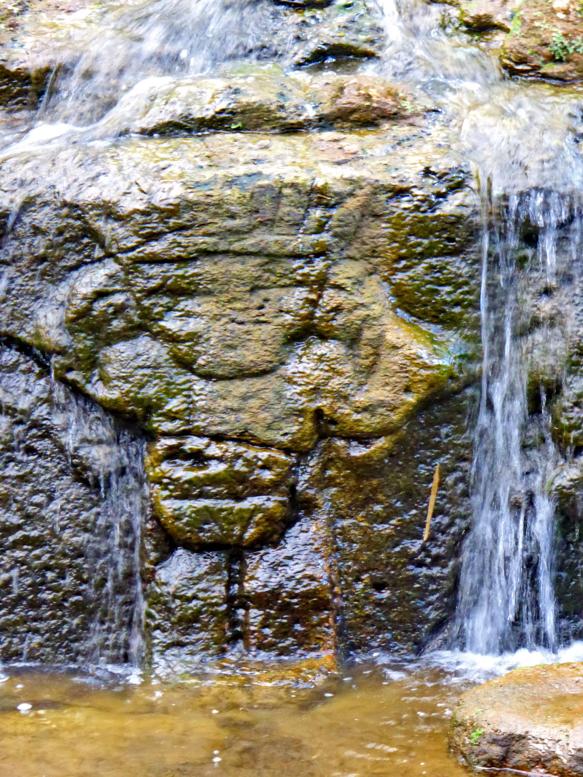 Labyrinth Fuente de Lavapas with channels and little basins in the park Parque Arqueologico of San Agustin
