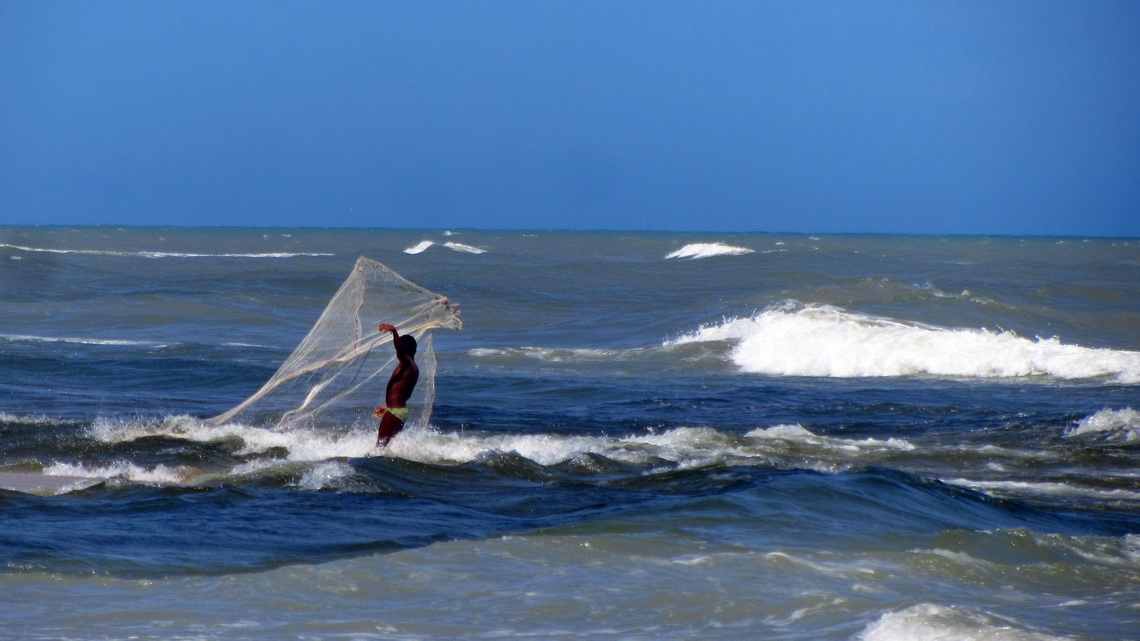 Fishing boy on the western beach of Palomina