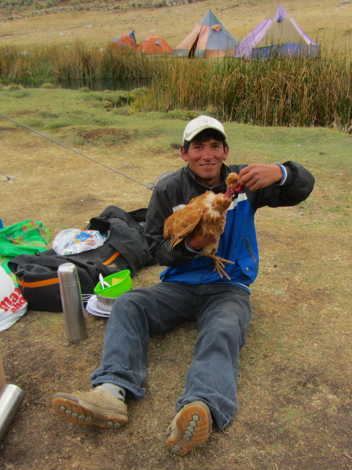 Susman with a chicken in the Jahuacocha camp