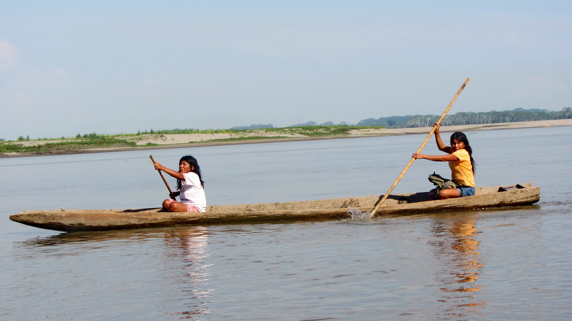 Two Ladies in a logboat on huge Rio Ucayali