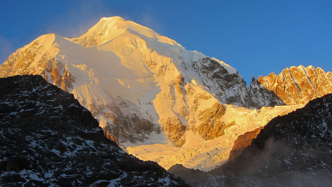 Majestic 6368 meters high Illampu at sunset, seen from Laguna Glaciar