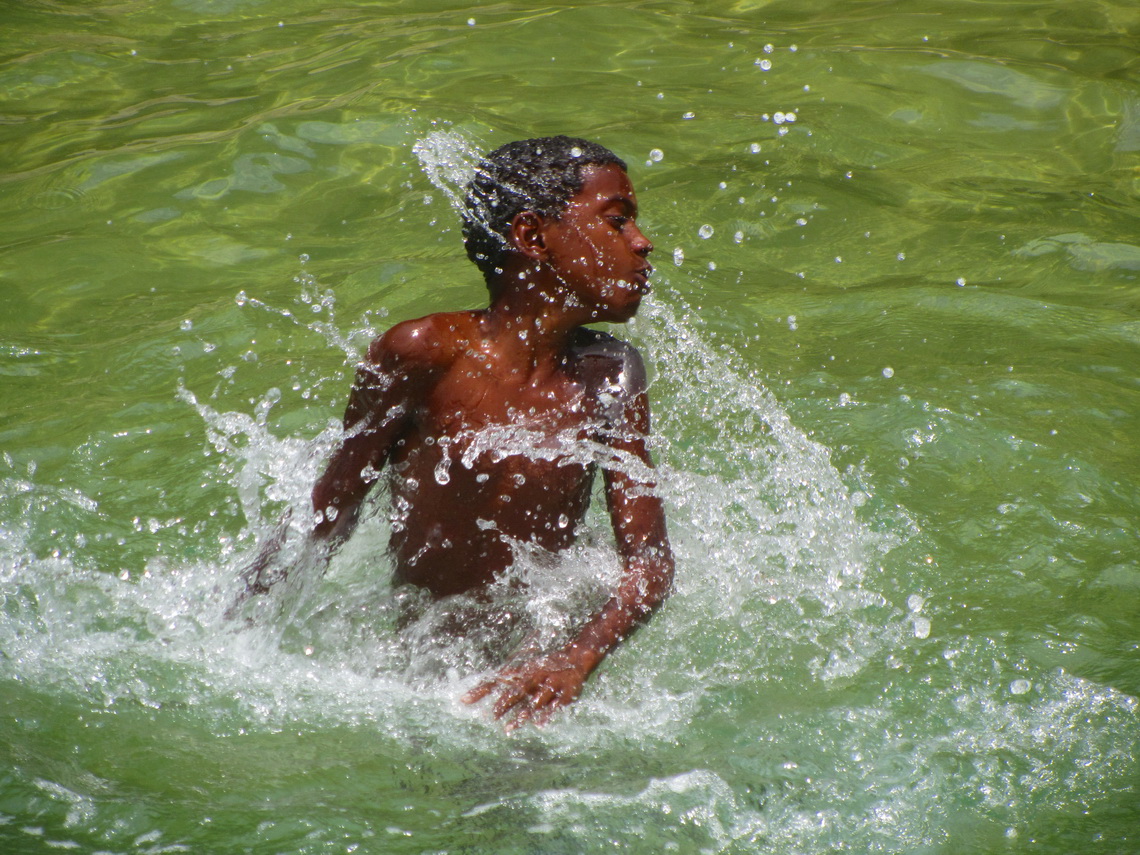 Cute boy playing in the ocean