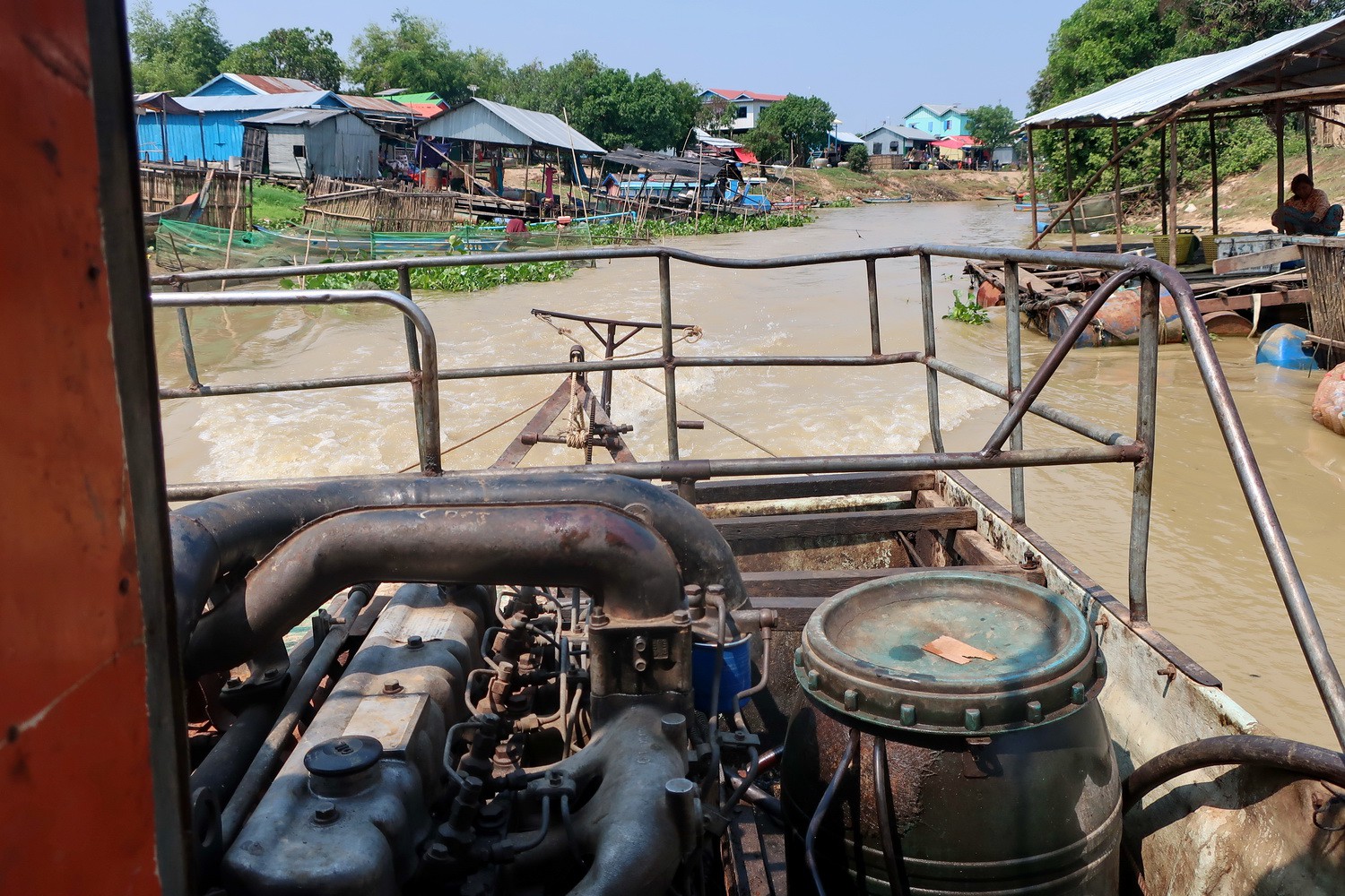 Engine of our boat with narrow Sangker River