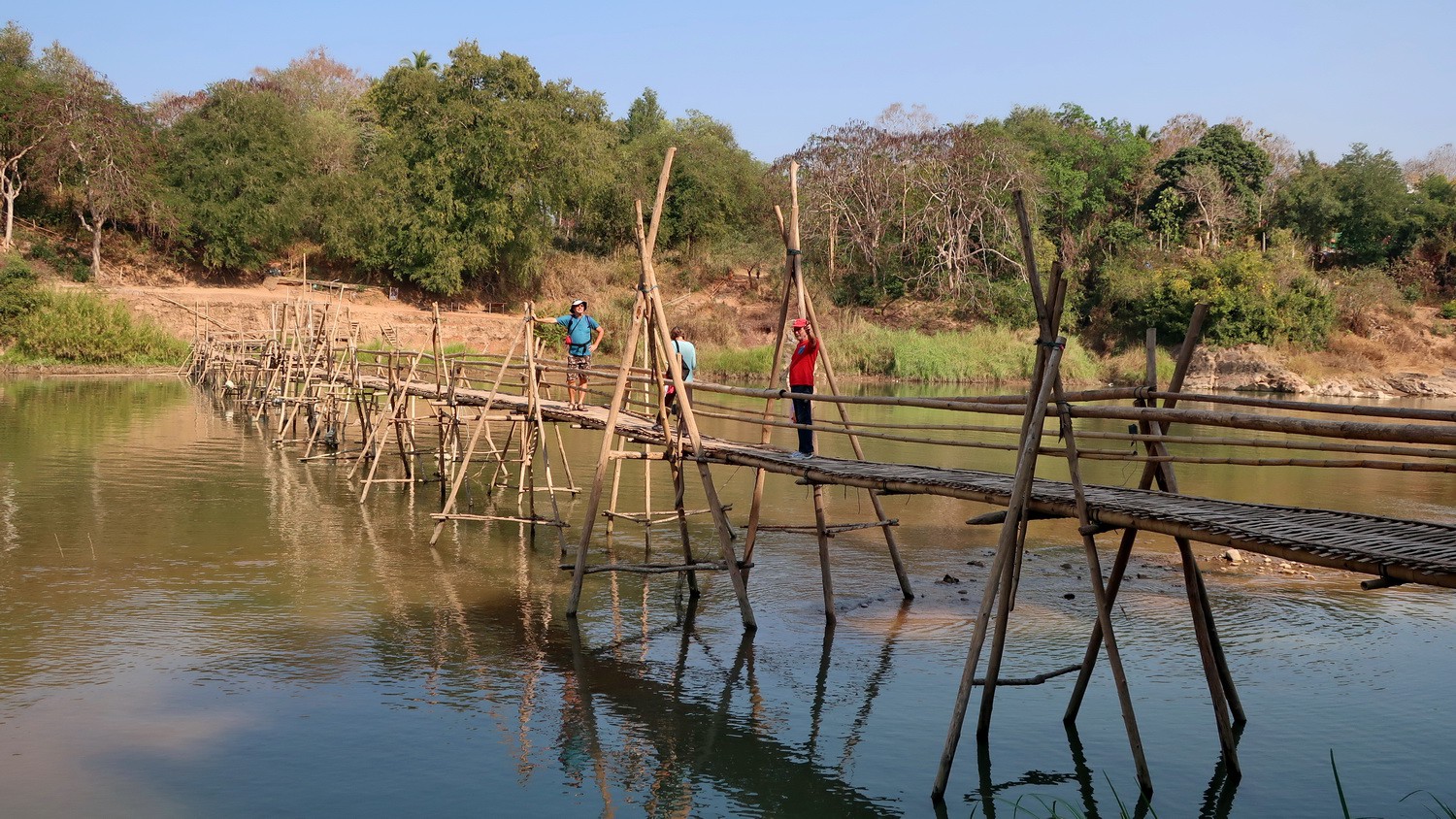 Crossing the northern bamboo bridge over Nam Khan river