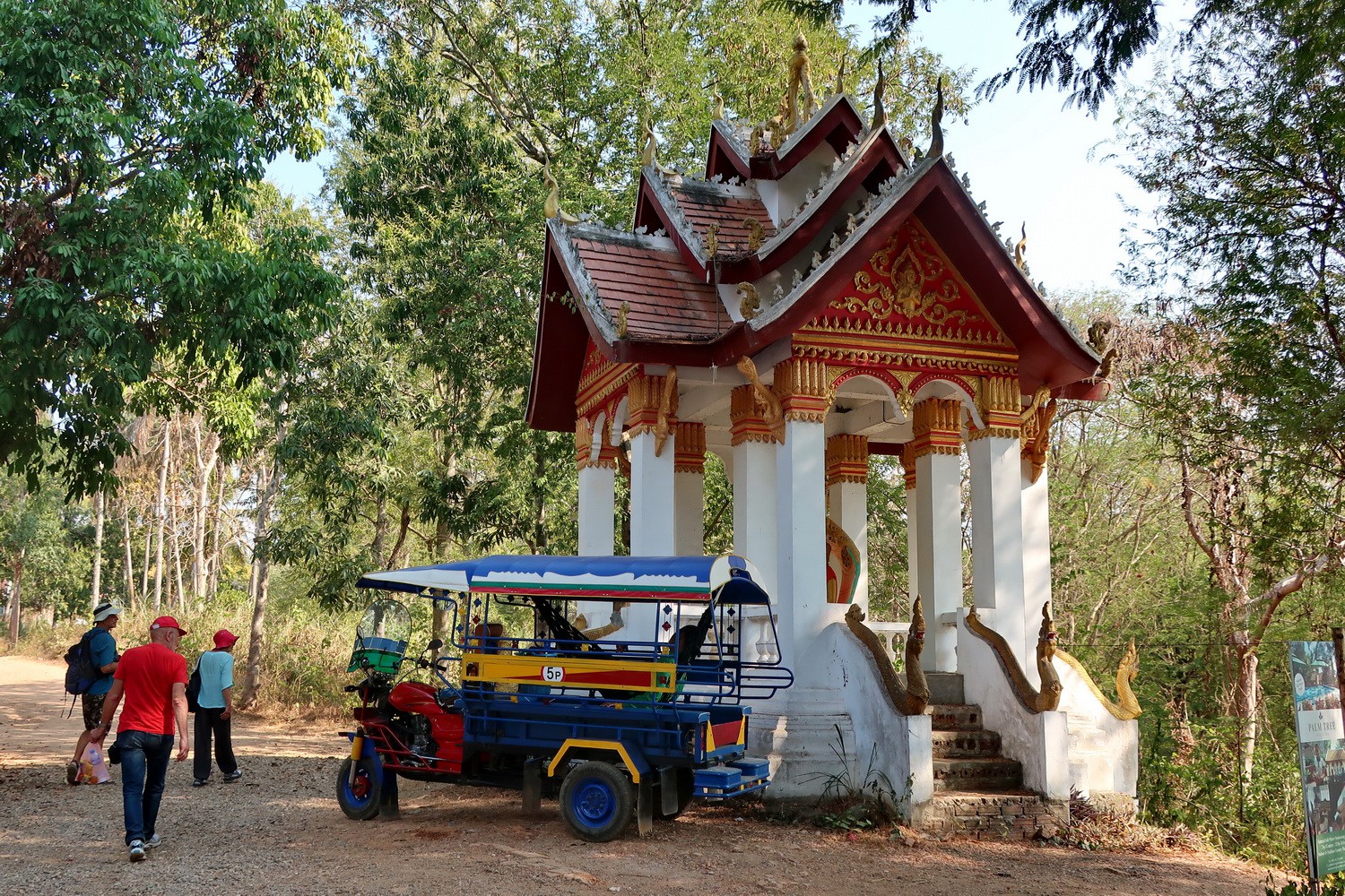 Little temple with a tuk-tuk on the viewpoint of the mouth of Nam Khan river into Mekong