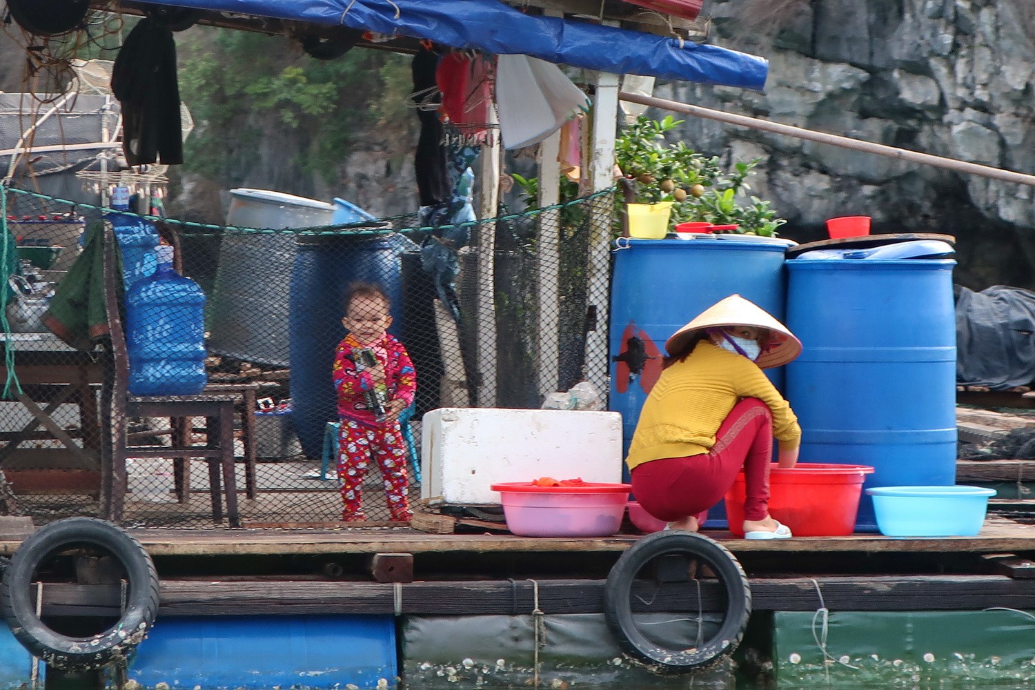 Little Boy with his Ma in the floating village of Cat Ba