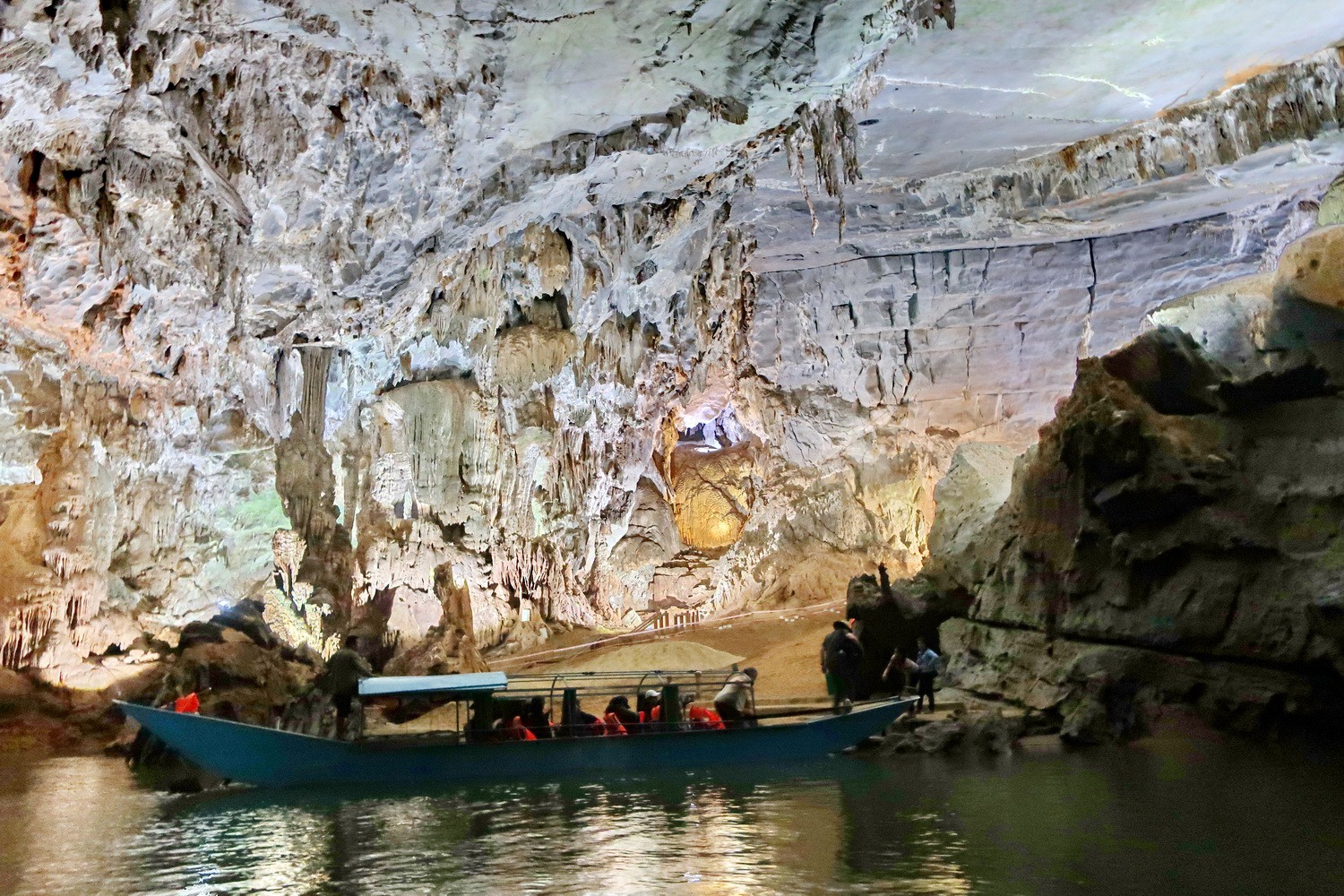 With a boat in the Phong Nha Cave