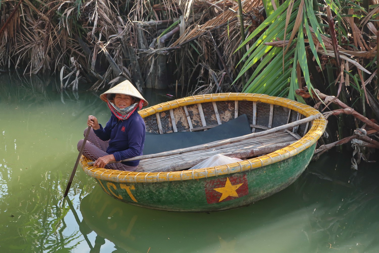 Lady in a tiny round boat
