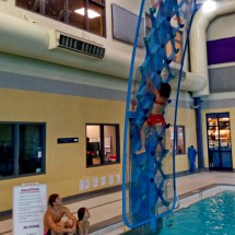 Rosemarie on the climbing wall in the pool of the Genesis Place of Airdrie