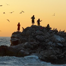 Fishing people with Pelicans on the southern end of Playa Zicatella