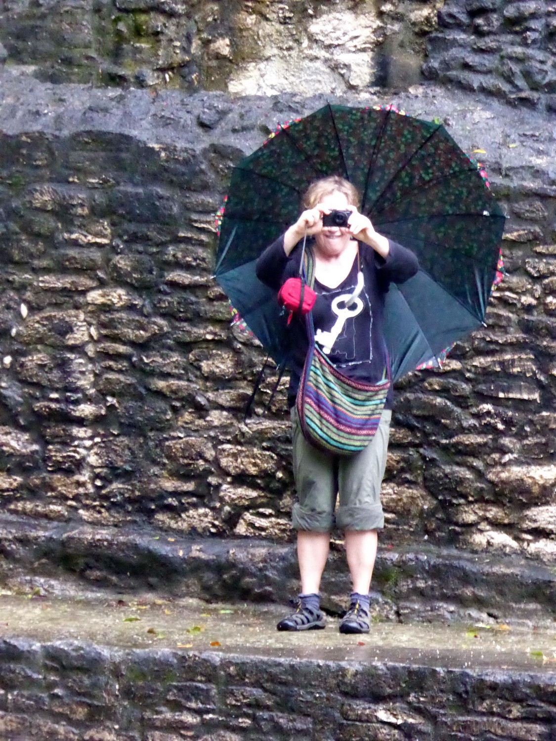 Marion taking a picture in the rain
