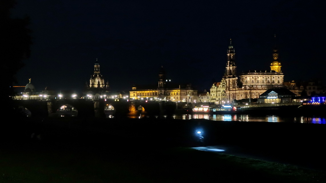 Skyline of the old town of Dresden with river Elbe, bridge Augustusbrücke, church Frauenkirche (left center) and cathedral Ss Trinitadis (right)