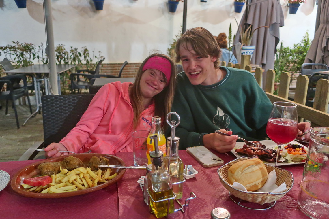 Sarah with French Fries and typical Spanish meat - Jay with Octopus and Sangria