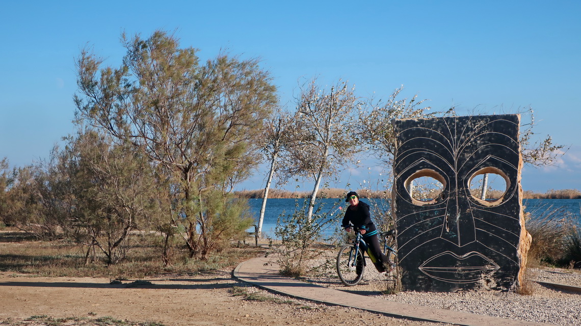 Marion with a face close to the viewpoint Mirador Zigurat where the river Ebro meets the Mediterranean Sea