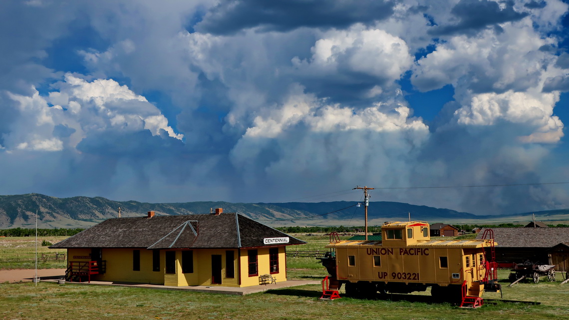 Station of Centennial with the huge Badger Creek Fire in the background