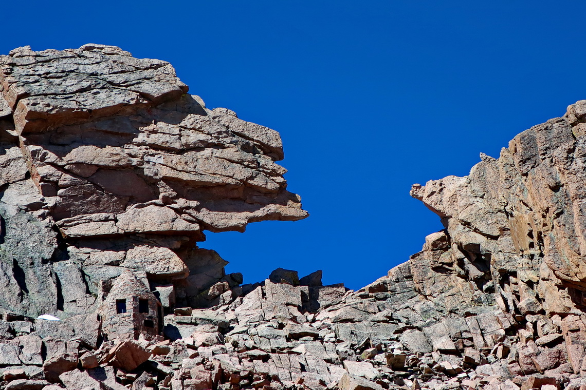 The keyhole in the north ridge of Longs Peak with a little hut on the left