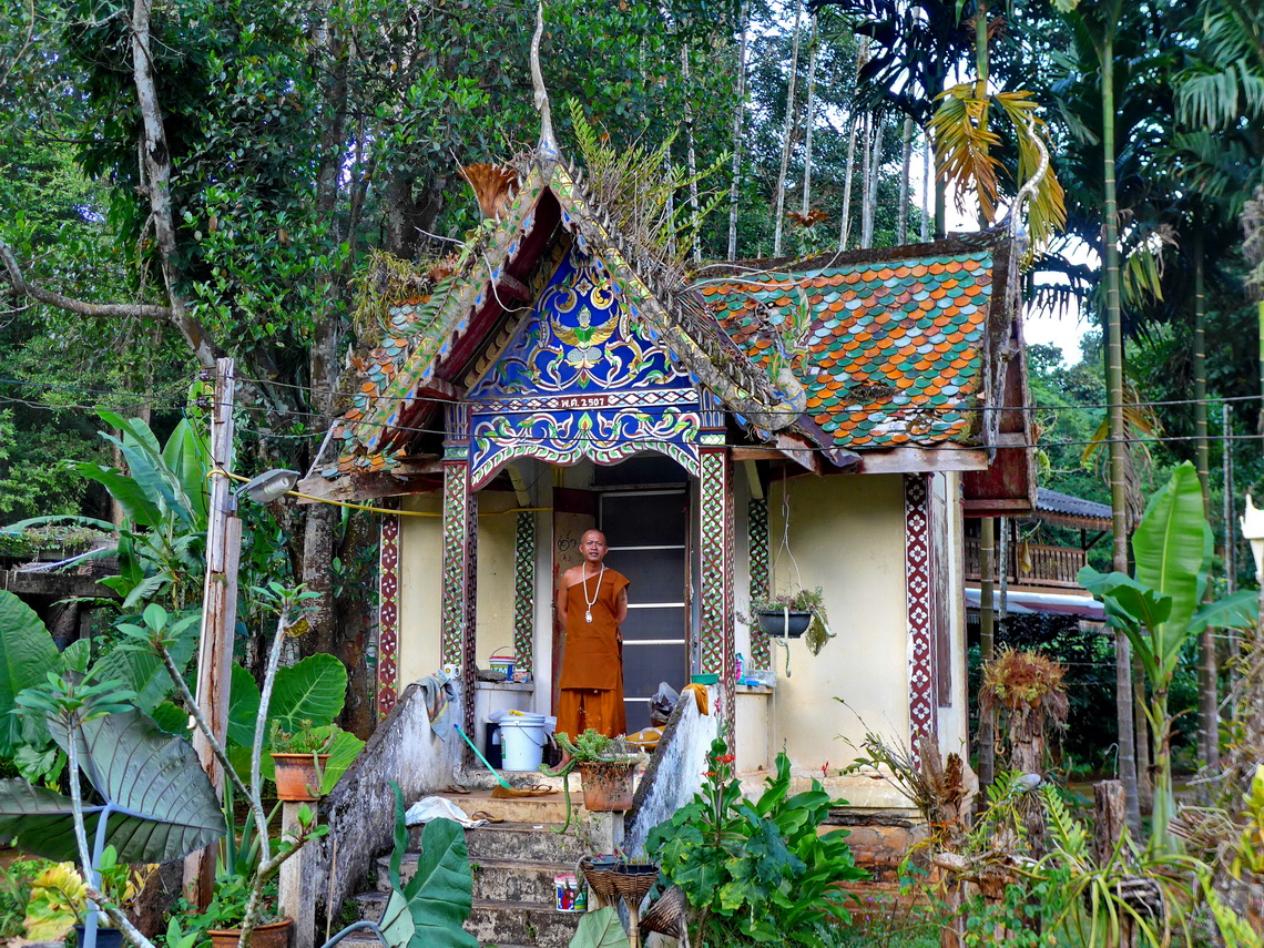 Little colorful temple with monk