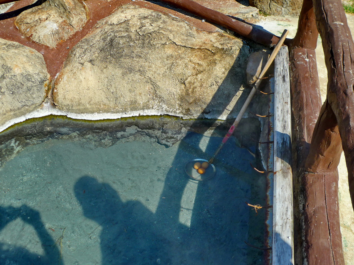 Boiling eggs in the hot water of the hot springs 