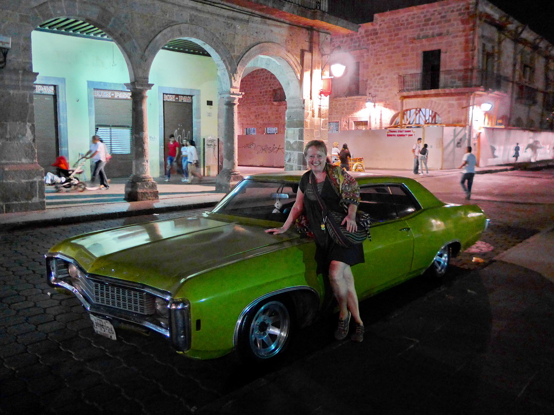 Marion with a fancy car in the old town of Morelia