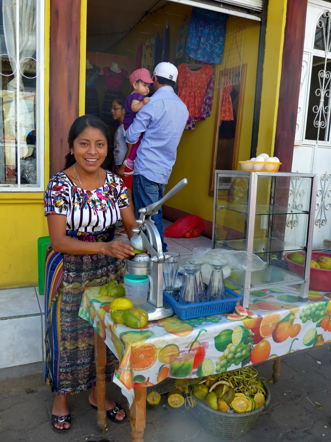 Lady selling fresh orange juice in San Juan la Laguna