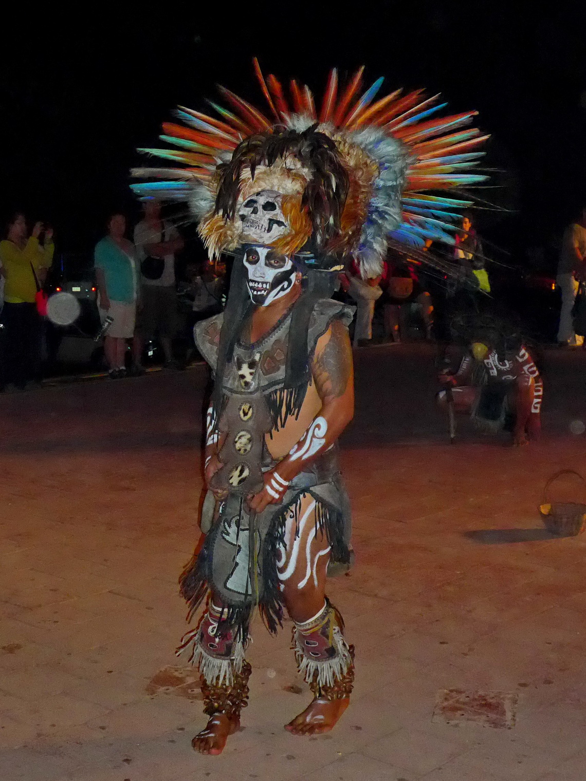 Dancing Maya shaman in front of the entrance